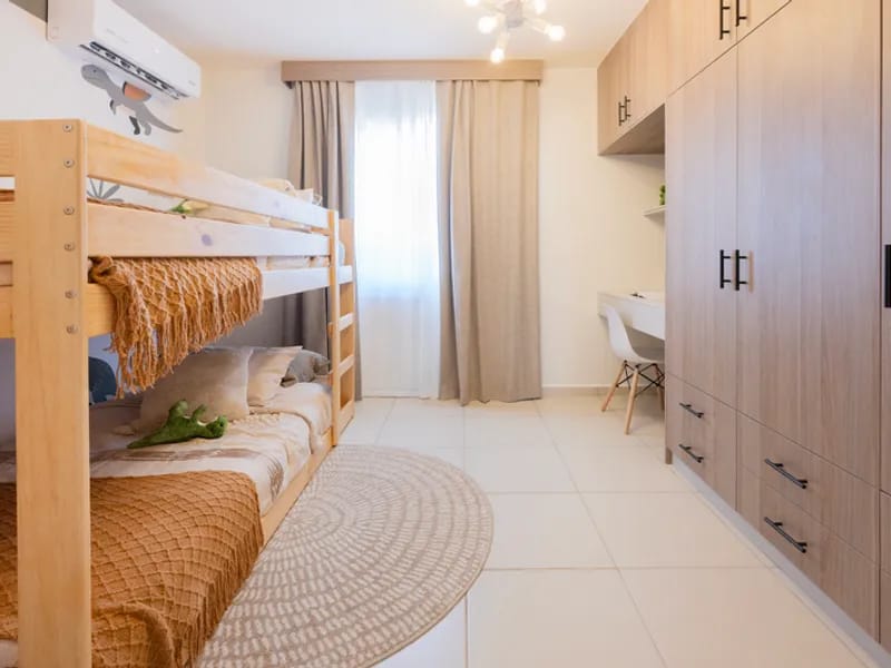 Recámara con litera del modelo Albatros del fraccionamiento El Jaral que pertenece a la inmobiliaria Javer